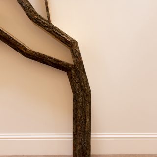 tree trunk wall shelves designed by bespoak interiors