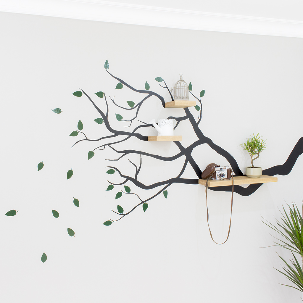 tree branch wall decal with floating shelves bespoak interiors
